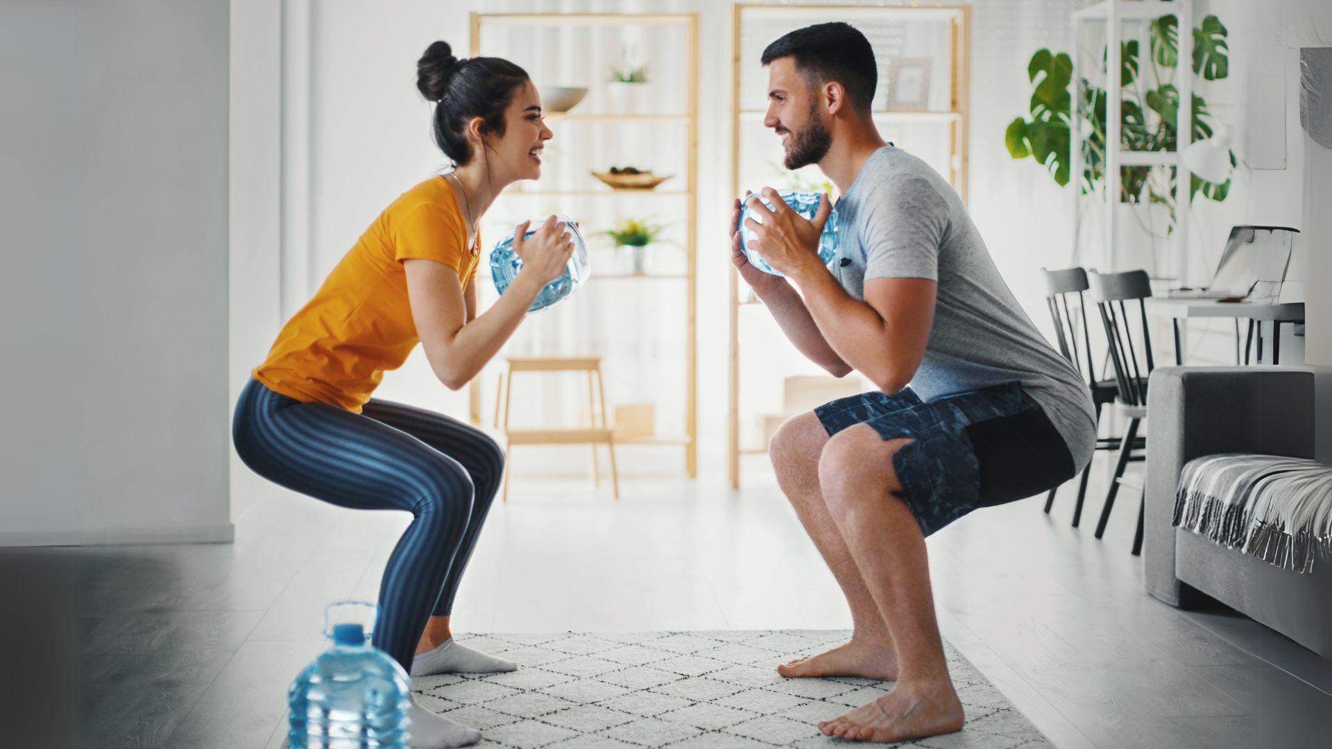 Couple Exercising with Water Bottles